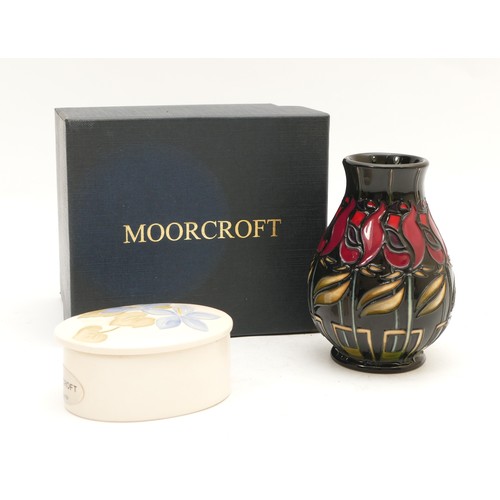 345 - A Moorcroft vase, in the pattern, 'Night Rose', dated 2009, H-10cm, boxed, together with a cream Moo... 