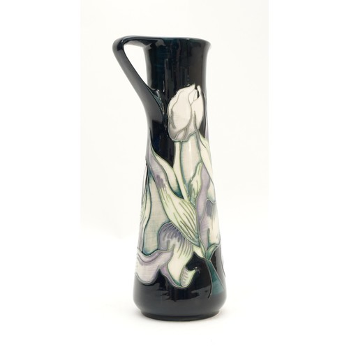 355 - A Moorcroft ewer, in the pattern, 'Snow Tulip', no. 59, designed by Nicola Slaney, dated 2012, H-19c... 