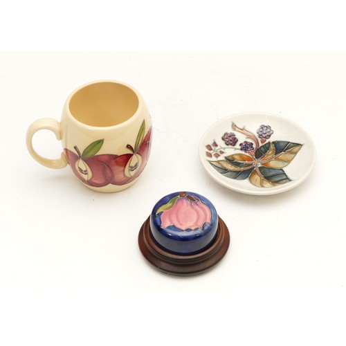 366 - Three Moorcroft pieces, to include, a trinket dish entitled 'Bramble', dated 1992 with the candlesti... 