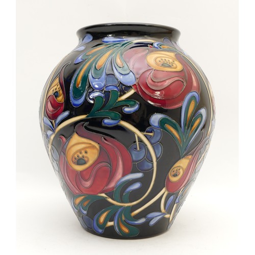 369 - A Moorcroft vase, depicting jewel tone florals, limited edition, 28/50, designed by Rachel Bishop, d... 