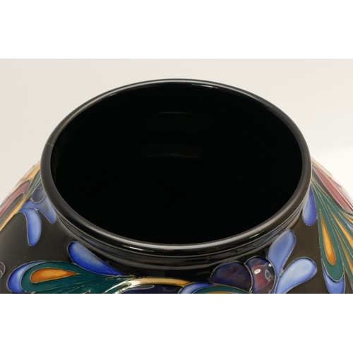 369 - A Moorcroft vase, depicting jewel tone florals, limited edition, 28/50, designed by Rachel Bishop, d... 