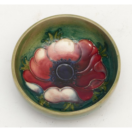 386 - A Moorcroft dish, in the pattern, 'Poppy', c. 1950s, stamped Moorcroft, diameter of 8cm.