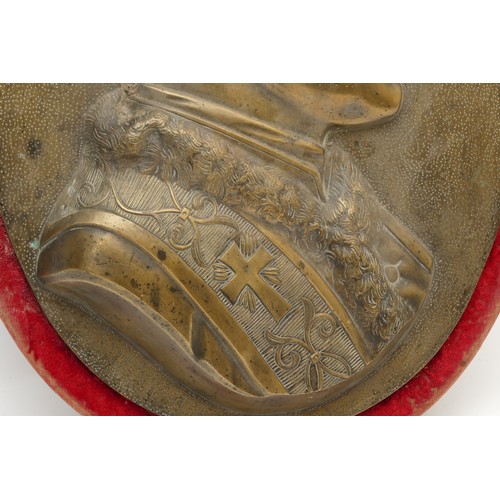 430 - A gilt bronze plaque, depicting the Pope, possibly Pope Pius XII, on a red velvet oval mount, 49cm x... 