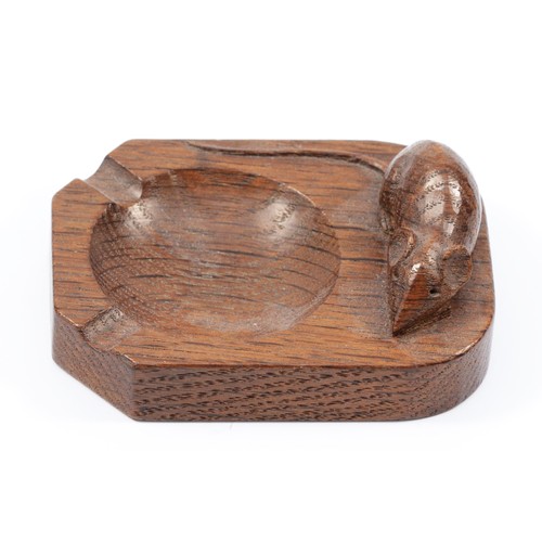 446 - Robert Mouseman Thompson (Kilburn) an English Oak ashtray, of standard rectangular form, with carved... 