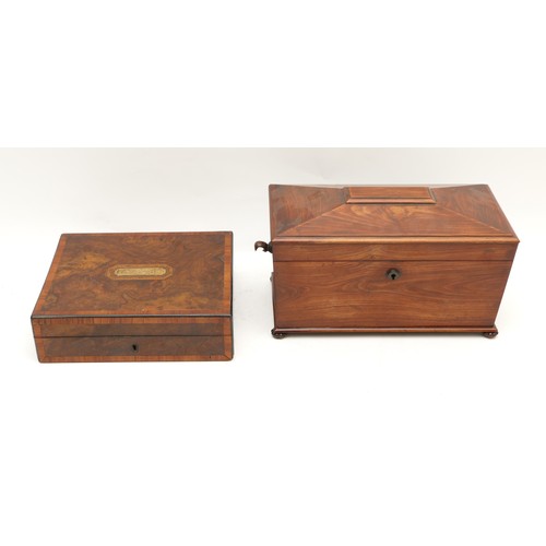 455 - A 19th century mahogany tea caddy of sarcophagus form, opening to reveal a mixing bowl and two caddi... 