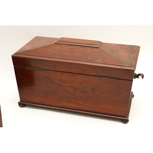 455 - A 19th century mahogany tea caddy of sarcophagus form, opening to reveal a mixing bowl and two caddi... 