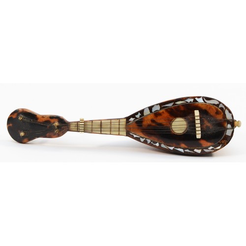 456 - A 19th century miniature tortoiseshell mandolin, with mother of pearl detail, 13.5cm