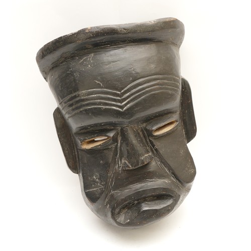 459 - A carved African tribal mask, with pronounced hair and ears, 38 x 28cm