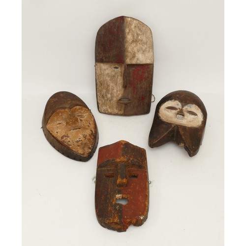 463 - Ethnographica & Tribal Art: four African tribal Gabon, Adouma Duma masks, carved wood with incised d... 