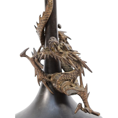 483 - A Japanese Meiji period bronze Genryusai Seiya style dragon vase, apparently unsigned, 25.5cm.
Lacki... 