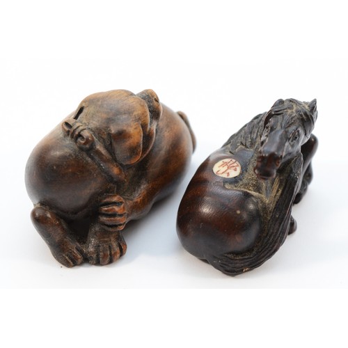 493 - A Japanese Meiji period netsuke of a recumbent horse, black glass eyes, inset signature, 4.5cm and a... 