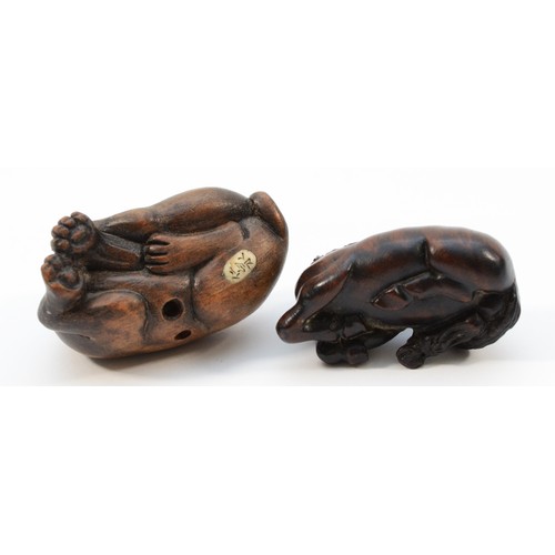 493 - A Japanese Meiji period netsuke of a recumbent horse, black glass eyes, inset signature, 4.5cm and a... 