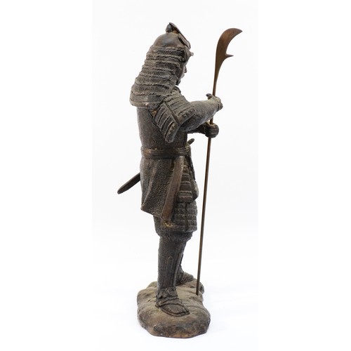 495 - A Japanese bronze of a Samurai warrior, holding an axe spear, apparently unsigned, 46cm