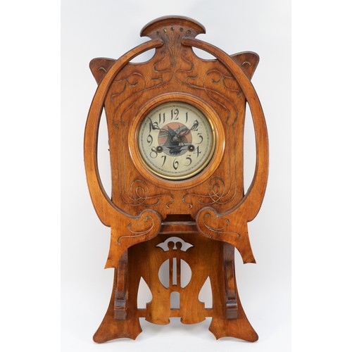 504 - An Art Nouveau walnut wall clock, the dial and pendulum bob with sailing boat decoration, the case w... 