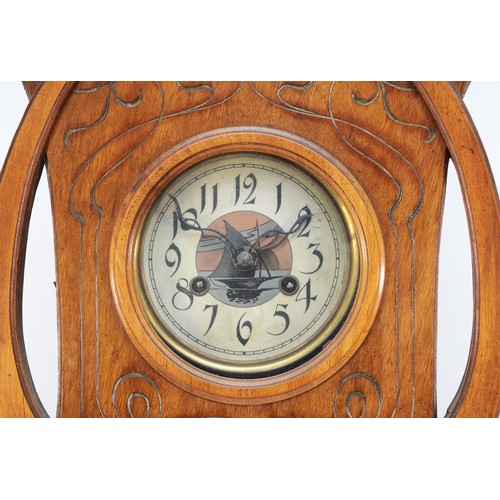 504 - An Art Nouveau walnut wall clock, the dial and pendulum bob with sailing boat decoration, the case w... 