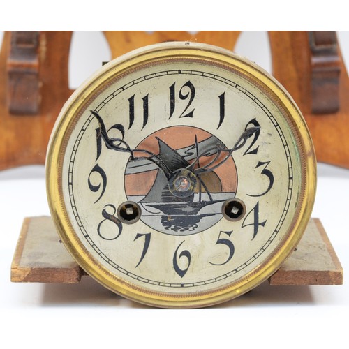 504 - An Art Nouveau walnut wall clock, the dial and pendulum bob with sailing boat decoration, the case w... 