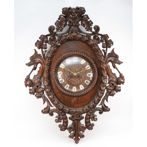 505 - A late 19th century Franco/German oak wall clock, the carved dial with porcelain Roman numerals, the... 