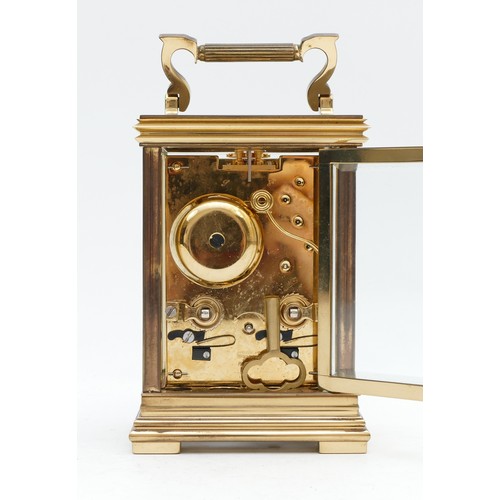 513 - Taylor & Bligh, England, a 20th century brass striking carriage clock, the white enamel dial signed,... 