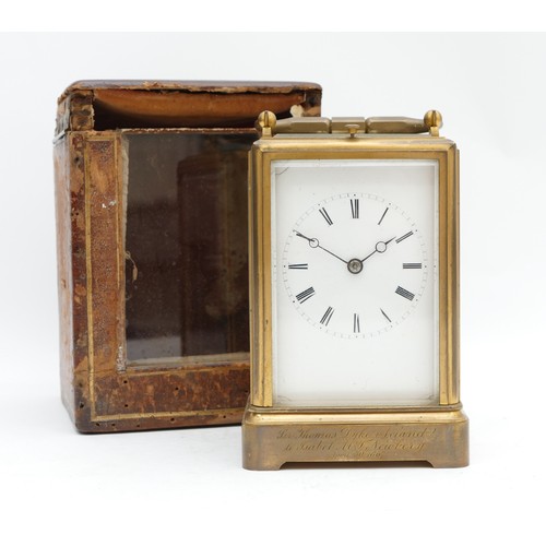 514 - A late 19th century brass repeating and striking carriage clock, white enamel dial with Roman numera... 