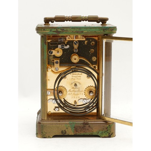 516 - Matthew Norman, London, an early 20th century brass alarm and striking carriage clock, the white ena... 