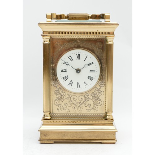 517 - A 20th century brass striking carriage clock, white enamel dial with Roman numerals and floral engra... 