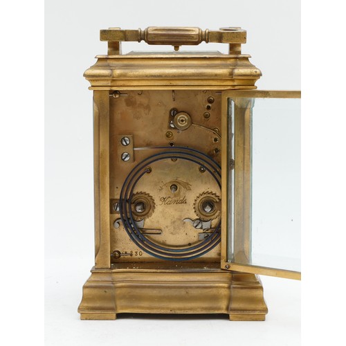 521 - A late 19th century French brass carriage striking and repeating clock, the white enamel  dial signe... 