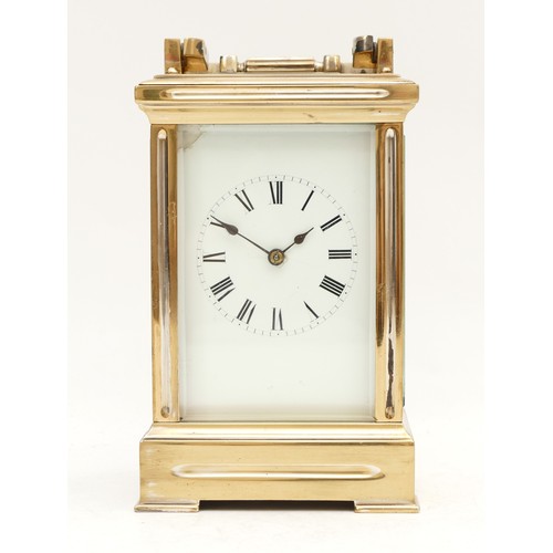 522 - A brass carriage clock, white enamel dial with Roman numerals, the unsigned movement striking the ha... 