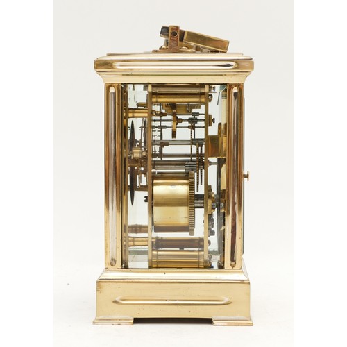 522 - A brass carriage clock, white enamel dial with Roman numerals, the unsigned movement striking the ha... 