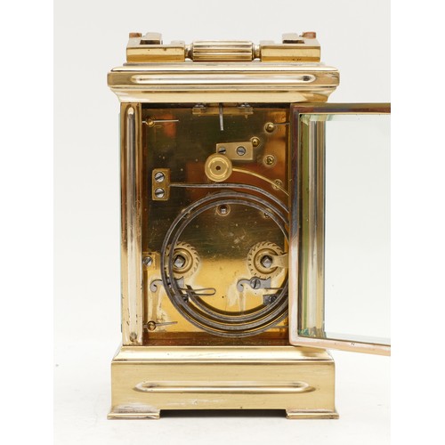 522 - A brass carriage clock, white enamel dial with Roman numerals, the unsigned movement striking the ha... 