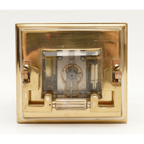 522 - A brass carriage clock, white enamel dial with Roman numerals, the unsigned movement striking the ha... 