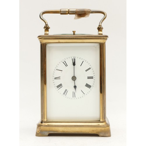 523 - A late 19th century brass striking carriage clock, white enamel dial with Roman numerals, the moveme... 