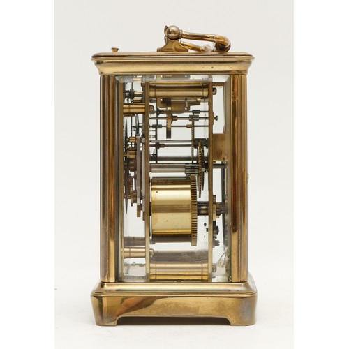 523 - A late 19th century brass striking carriage clock, white enamel dial with Roman numerals, the moveme... 