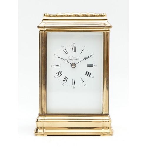 524 - Halfhide, a brass striking carriage clock, signed white enamel dial with Roman numerals, the Anglais... 