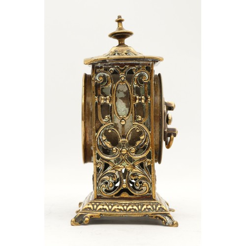 533 - The British United Clock Co., Ltd., a late 19th pierced cast brass desk clock, with cherub dial, 14.... 