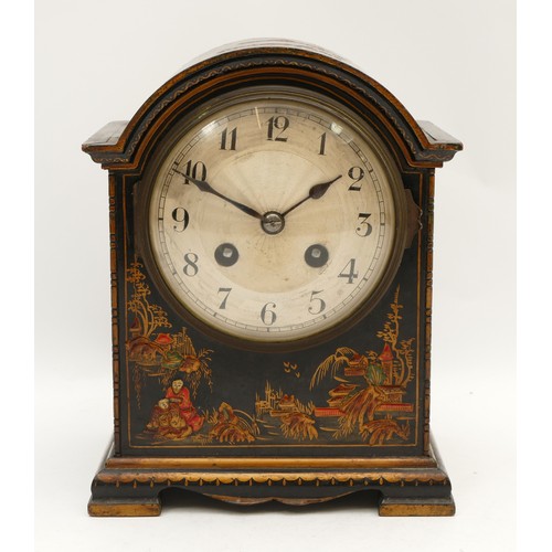 542 - A French Chinoiserie mantel clock, black field with raised figures and buildings, 20.5 x 16cm.
Not w... 