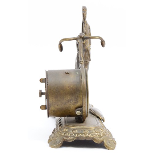 544 - The British United Clock Co., Ltd., an early 20th cast novelty brass desk clock, c.1910, in the form... 