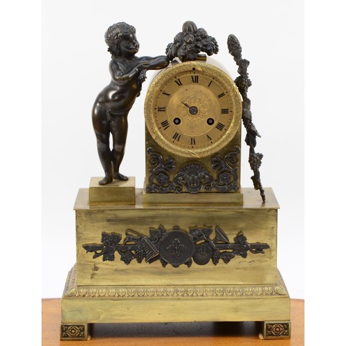 547 - A late 19th century bronze and gilt bronze figural mantel clock, with cherub to one side, pendulum, ... 