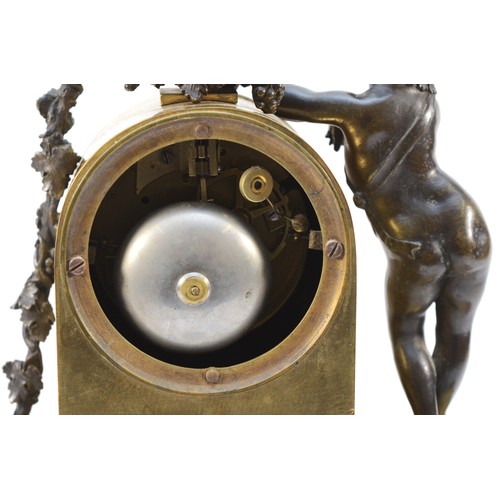 547 - A late 19th century bronze and gilt bronze figural mantel clock, with cherub to one side, pendulum, ... 