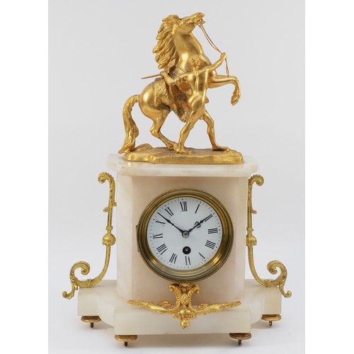 549 - A late 19th century French gilt metal and alabaster mantle clock, surmounted by a Marley horse, the ... 