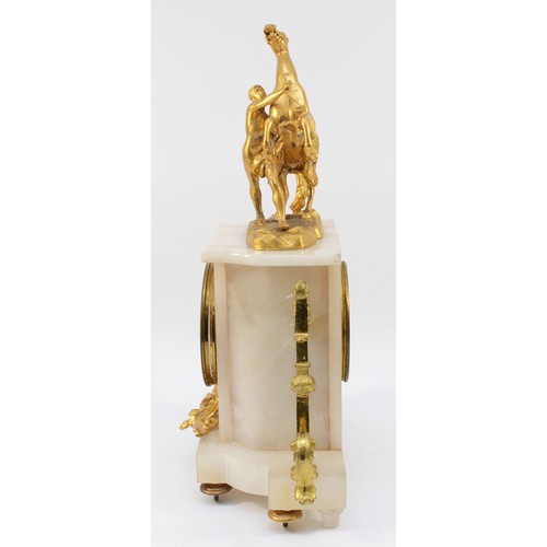 549 - A late 19th century French gilt metal and alabaster mantle clock, surmounted by a Marley horse, the ... 