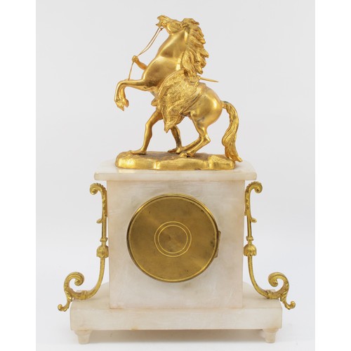 549 - A late 19th century French gilt metal and alabaster mantle clock, surmounted by a Marley horse, the ... 