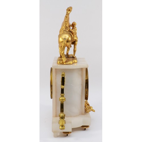 549 - A late 19th century French gilt metal and alabaster mantle clock, surmounted by a Marley horse, the ... 