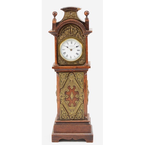 551 - W. Thornhill & Co., an Edwardian oak and brass miniature longcase clock, white enamel dial with Roma... 