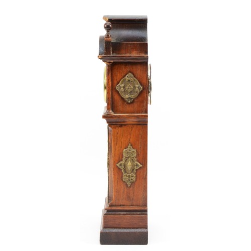 551 - W. Thornhill & Co., an Edwardian oak and brass miniature longcase clock, white enamel dial with Roma... 