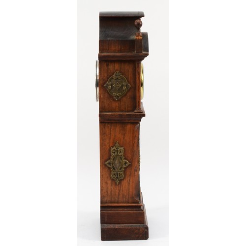 551 - W. Thornhill & Co., an Edwardian oak and brass miniature longcase clock, white enamel dial with Roma... 