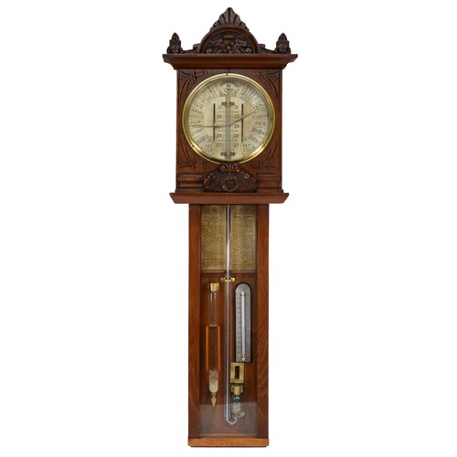 557 - A late 19th century Improved Admiral Fitzroy barometer in carved oak cased with printed circular sca... 