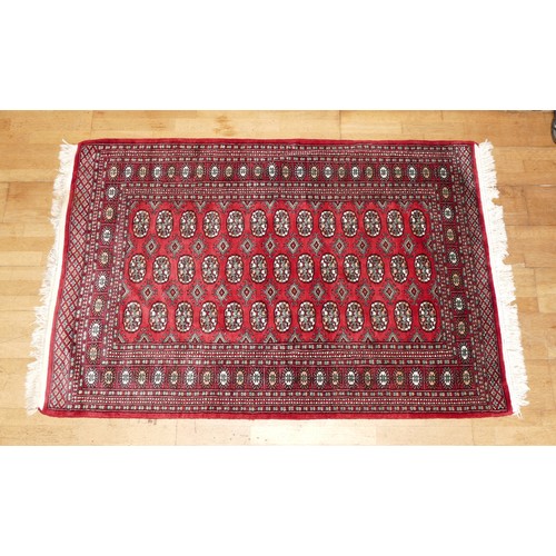 573 - A Teke Turkmen Bokhara Deluxe rug, with a fringe trim, the Teke design is inspired by elephant footp... 