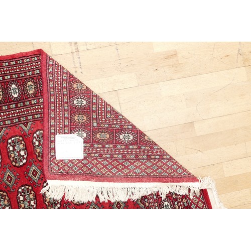 573 - A Teke Turkmen Bokhara Deluxe rug, with a fringe trim, the Teke design is inspired by elephant footp... 