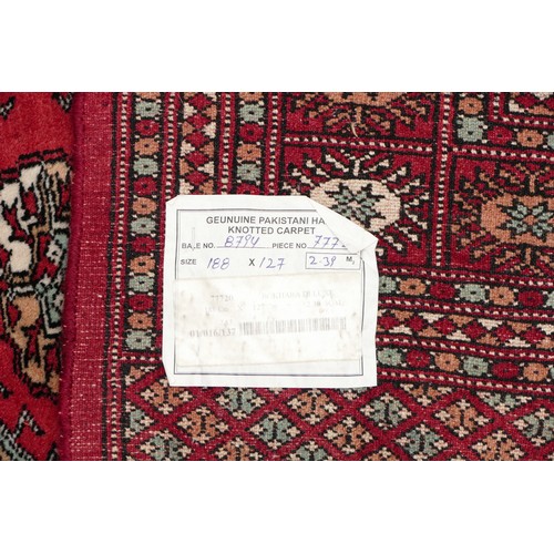 573 - A Teke Turkmen Bokhara Deluxe rug, with a fringe trim, the Teke design is inspired by elephant footp... 