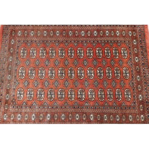 574 - A hand-knotted Teke Turkmen Bokhara Deluxe rug, with a fringe trim, the Teke design is inspired by e... 